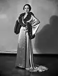 Priscilla Lawson in a satin and fur negligee
