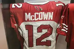 A photo of a white and red #12 jersey with the name "McCown" on the back