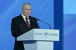 Putin speaking at the Russia-Africa parliamentary conference in Moscow on 20 March 2023. According to the Economist Intelligence Unit, two-thirds of the world's population live in countries that are neutral or leaning towards Russia.[171]