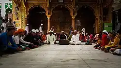 A qawwali performance at the Ajmer Sharif Dargah at Ajmer, India. The dargah houses the grave of Moinuddin Chishti of the Chishti order.