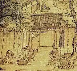A small, square excerpt of painting showing a large open space enclosed by walls about twice the height of an adult. The walls are topped with large, pyramidal spikes. Several men sit in front of an open thick metal gate.