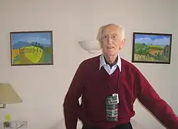 Lister in his nineties, with some of his paintings