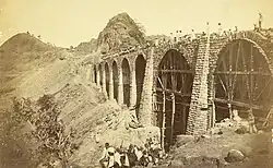 Photograph (1855) showing the construction of the Bhor Ghaut incline bridge, Bombay; the incline was conceived by George Clark, the Chief Engineer in the East India Company's Government of Bombay