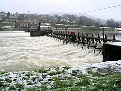 A manually operated needle dam-type weir near Revin on the River Meuse, France