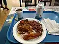 Rice and frijoles guisados (stewed beans) accompanied with ropa vieja and plantain, made in Panama
