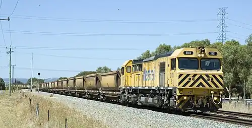 Modern S class diesel locomotive on a bauxite train at Wellard