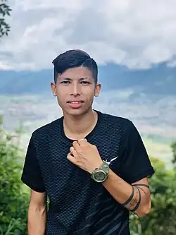 Sabitra Bhandari in black T-shirt.