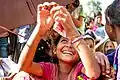 A forcedly displaced Rohingya girl queued and waiting with other hundreds to collect food and supplies at Kutupalong makeshift refugee camp.
