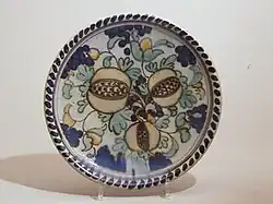 Dish with polychrome decor of pomegranates, 1930