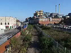 In March 2011 the unused trackbed has been cleared but vegetation has a greater hold on the platform