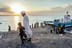 People visiting a boat on Lake Urmia