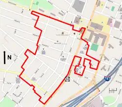 A street map of south central Albany showing the district boundary as a red line