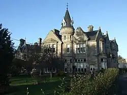 Scottish Baronial-style mansion house built of stone.