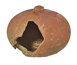 Broken money box in red earthenware (between 1250 and 1350), archaeological find from Bruges.
