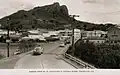 Looking across the Victoria Bridge to Townsville CBD with Castle Hill, Townsville in the background, circa 1955