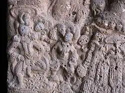 Stone carving of woman playing Tabla at Bhaje caves