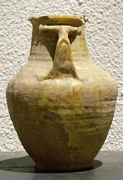 Storage jar with two handles and a gold-coloured glaze, excavated from grave Fu12 in ʿAmlāʾ/al-Fuwayda, attributable to the PIR.