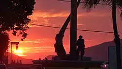 Sunset at El Pescador Monument in Playa Norte