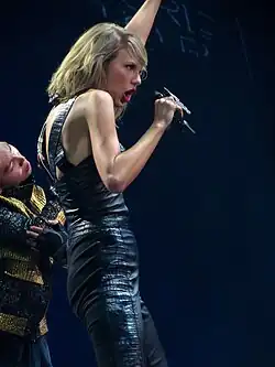 Swift performing, dressed in a black leather outfit