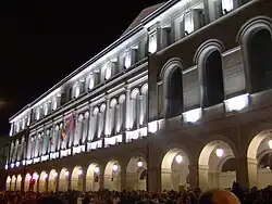 The facade at night