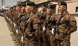 Members of the Mongolian Expeditionary Task Force 1 stand in formation for Mongolian Army Day at Camp Eggers, Afghanistan. Mongolian Army Day is an annual event that has occurred since 1921.