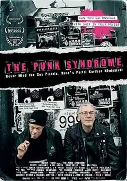 A poster featuring two members of the band sitting in front of black and white gig promotional posters.