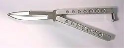 A butterfly knife with steel handles and lightening holes.