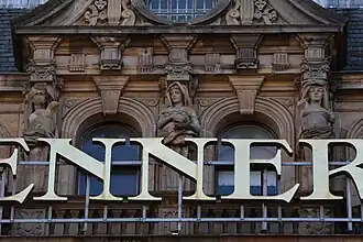 Three caryatids supporting pediment over Bay 4, South Saint David Street façade