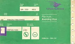 A boarding ticket issued by Garuda Indonesia, colored mainly in green. The ticket shows a passenger flying GA 150 to Medan. The boarding ticket shows that there are non-smoking and smoking sections on the aircraft.