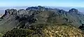 View from Emory Peak with flat-topped Toll Mountain centered. Lost Mine Peak centered beyond. Casa Grande Peak to left, Crown Mountain to right. Camera pointed northeast.