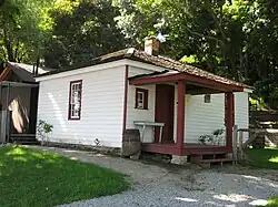 Exterior view of a white wooden building from the 19th century