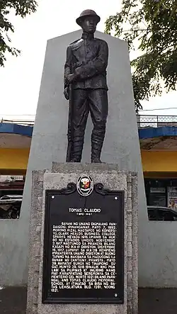 Statue of Claudio and 1992 historical marker installed at the Morong Town Plaza