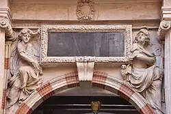 On the western portal of the Henri IV courtyard of the Toulouse Capitole, two sculpted figures embody Lady Tholose / Pallas (1678).
