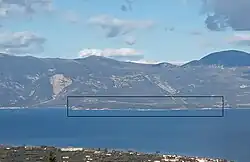 View of Trizonia island as seen from Peloponnese. (outlined with a black line)