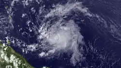 A visible satellite image of a fast-moving and weak tropical storm in the central Atlantic.