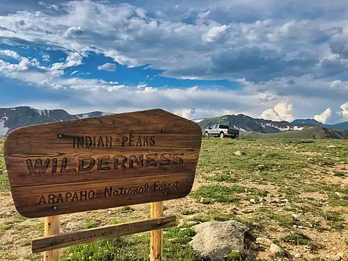 A vehicle has not followed the published Motor Vehicle Use Maps (MVUMs) and has parked inside of the Indian Peaks Wilderness area, where motorized vehicles are prohibited. Fines can be as much as $5,000.[306]