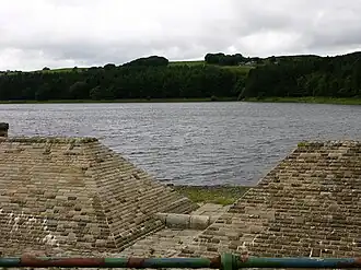 A brick-lined overflow, with a reservoir beyond