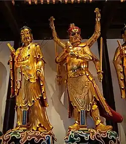 Jade Buddha Temple (Shanghai, China) - Statues of Kinnara (Jǐnnàluó) on the left and Shiva (Dàzìzàitiān or Móxīshǒuluótiān) on the right.