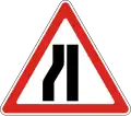 Road narrows on the left