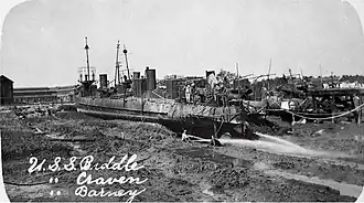 USS Craven (TB-10), Biddle (TB-26) and Barney (TB-25) washed ashore at Charleston Navy Yard by a hurricane on 28 August 1911.