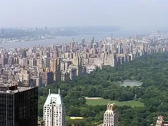 The Upper West Side on the left, and Central Park on the right, as seen from the Top of the Rock observatory at Rockefeller Center. In the distance is the Hudson River on the far left, and the George Washington Bridge in the background.