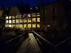 The Faux-Martel factory lit up at night