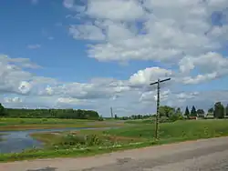 The Vekhsa River and the village of Uspolon in Shimsky District