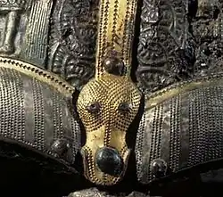 Central brow dragon head on the Vendel XIV helmet (560–575)
