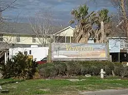 Venetian Isles sign on Highway 90