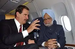 President Vicente Fox and Prime Minister Manmohan Singh flying to Scotland to attend the 31st G8 summit; 2005.