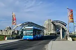 Blue bus at a station