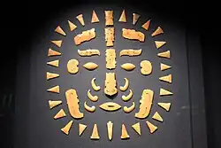 Fifty small pieces, including some carved in the shapes of individual features of a face