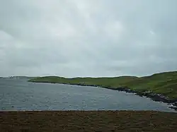Looking SSW across the Bight of Cudda on the west of the sound towards the Head of Berg on West Linga