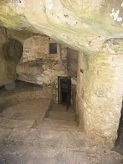 The exterior of the church of Aghia Kyriaki. The hermit's quarters are on the left of the church entrance]]